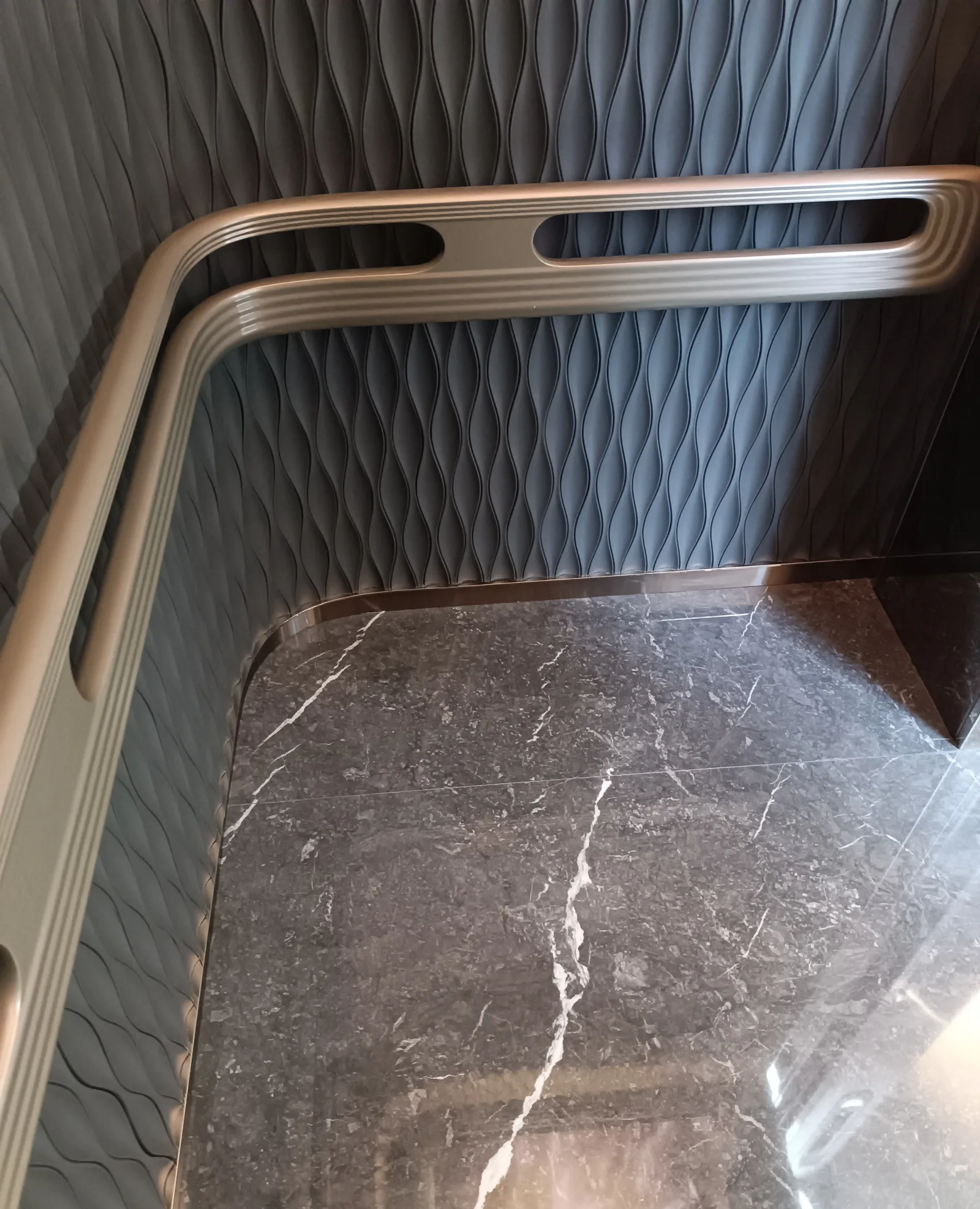 Modern elevator cab interior with wood-finish panels